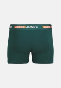 Donkergroene katoenen boxershorts met een aansluitend ontwerp. Beschikt over een brede elastische tailleband in groen, wit en oranje met merknnaam.