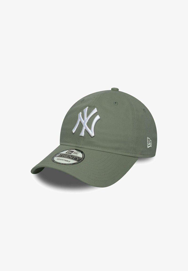 Olive green baseball cap with a white embroidered New York Yankees logo, adjustable strap, and round visor design. Textured fabric finish.