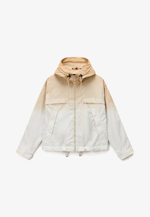 Beige og off-white hættejakke i vindbreaker-stil med frontlynlås, snoretræk ved hætten og kanten samt justerbare håndledsremme.