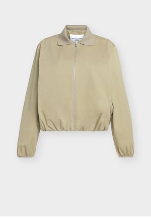 Chaqueta ligera beige con cremallera frontal, cintura y puños elásticos, y un pequeño cuello, etiquetada Marc O'Polo Denim.