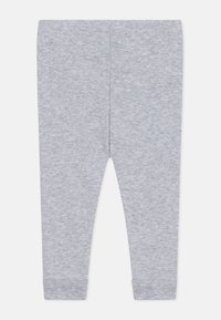 Leggings in cotone grigio con una texture liscia, forma affusolata, vita elasticizzata e polsini fitted alle caviglie. Nessun motivo o decorazione.