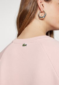 Lacoste SF0852_70V - Sudadera - waterlily