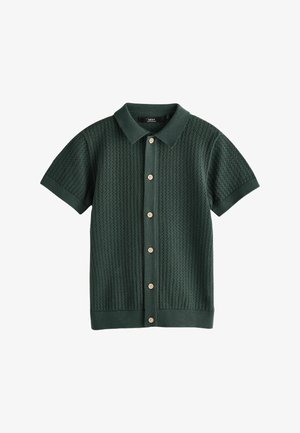 Cardigan tricotat verde închis, cu mâneci scurte, cu guler și șase nasturi bej în față, pe fundal alb.