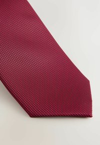 Burgundy tie with a textured, woven pattern and a pointed end. It has a smooth finish and a subtle sheen.