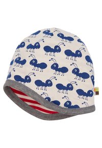 Cappello beanie in cotone color crema con motivo di formiche blu, dotato di un bordo grigio e di un rivestimento a righe rosse. Tessuto morbido e vestibilità elastica.