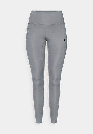 Pilkos tamprės iš lygaus, tampraus audinio, su aukšta liemeniu ir šoninėmis kišenėmis. Juodas logotipas ant apatinės kojos dalies.