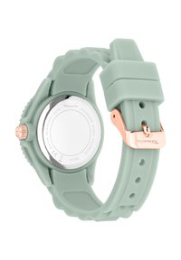 Une montre en silicone vert menthe avec un fond en acier inoxydable, dotée d'une boucle en or rose et d'accents texturés sur le bracelet.