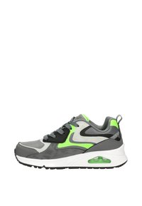 Gray athletic shoe with neon green accents, synthetic upper, textured laces, cushioned sole, and visible air unit in the heel.