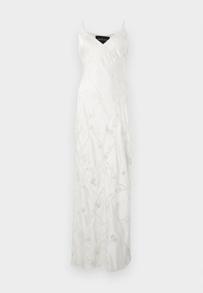 Λευκό αμάνικο φόρεμα μέχρι το πάτωμα με λεπτές τιράντες και λεπτή ανθιστή κεντητική σε όλο το ύφασμα.