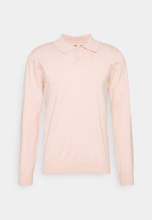 Long-sleeve polo shirt in soft pink, made from lightweight fabric. Features a collar, three buttons, and ribbed cuffs and hem.