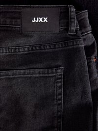 JXTURIN - Traperice krojene za nošenje s čizmama - black denim