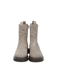 Pair of beige suede ankle boots with side zippers, pull tabs, and thick dark brown treaded soles, shown from the front on white background.