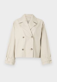 Beige cropped jacket with a double-breasted design, large lapels, and button accents. Features rolled cuffs and a smooth texture.