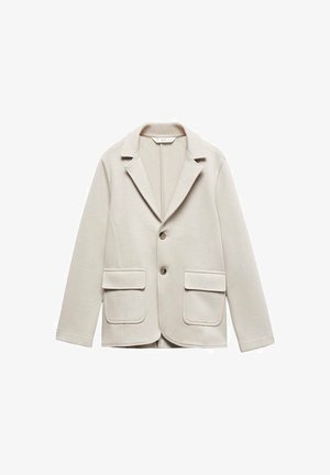 Blazer beige clair en tissu texturé. Doté d'un col cranté, d'une fermeture à un bouton et de deux poches plaquées à l'avant.
