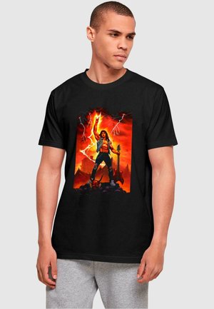 Black cotton t-shirt featuring a colorful graphic of a muscular figure holding a guitar against a fiery background with lightning and mountains.