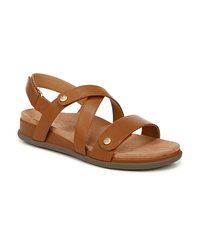 Brown leather sandal with crisscross straps, adjustable back, tan cushioned footbed, and a rubber sole. Gold hardware accents present.