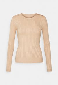 Pull long à manches longues beige à côtes avec un col rond et des boutons aux épaules, fabriqué dans un tissu doux et texturé.