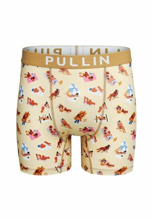 Boxer beige avec une ceinture marron affichant le nom de la marque, couvert d’un motif coloré de petites personnes prenant le soleil et se relaxant sur des serviettes et des chaises.