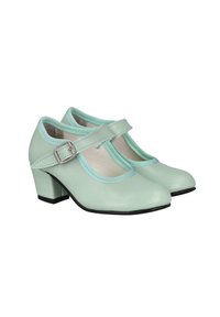 Zapatos Mary Jane de cuero verde menta con punta redonda, tacón bajo y detalle de correa con hebilla. Cuentan con un forro suave y un ribete en contraste.