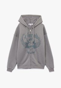 Grijze rits hoodie met een grote grafische print van vleugels en tekst. Heeft een verstelbare capuchon en ribgebreide manchetten. Van een zachte katoenmix.