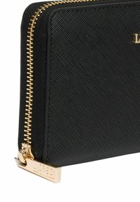 Black textured wallet with a gold zipper and hardware. Features a rectangular shape and a logo plate on the side.