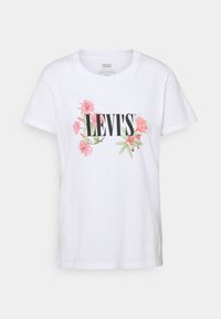 Bílý bavlněný tričko s krátkým rukávem a kulatým výstřihem, s květinovým vzorem a logem "LEVI'S" v tučných černých písmenech.