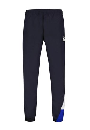 Jogging en marine avec taille élastique. Présente des accents blancs et bleus sur les côtés inférieurs. Fabriqué à partir d'un tissu lisse et respirant.