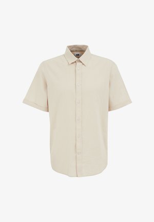 Camicia a maniche corte con bottoni in tessuto beige chiaro, caratterizzata da un colletto a punta, sei bottoni sul davanti e un orlo leggermente curvo.