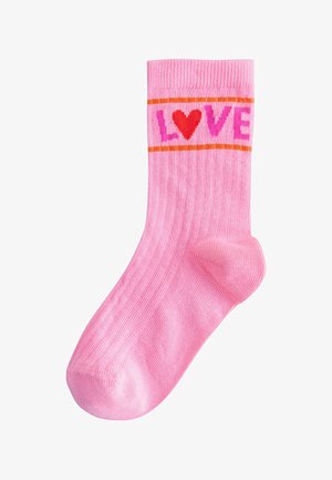 Pink sock with red heart and pink letters spelling "LOVE" bordered by two thin orange lines near the top.