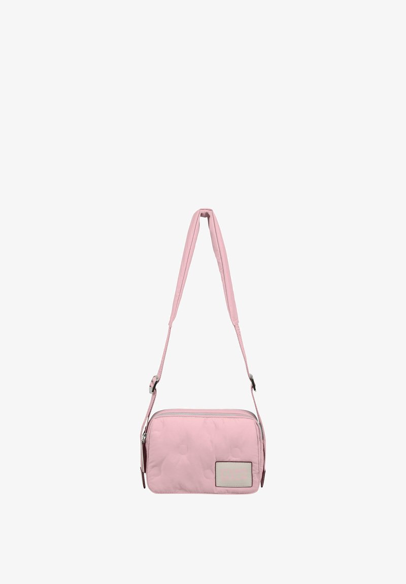 Quilted pink crossbody bag with adjustable strap, zip closure, and a rectangular brand tag on the front. Smooth texture and compact design.