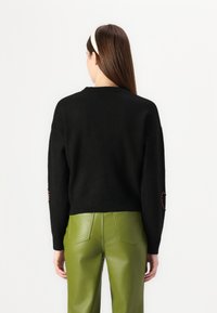 ONLY ONLDAISY O NECK BLING  - Pulover - black/red