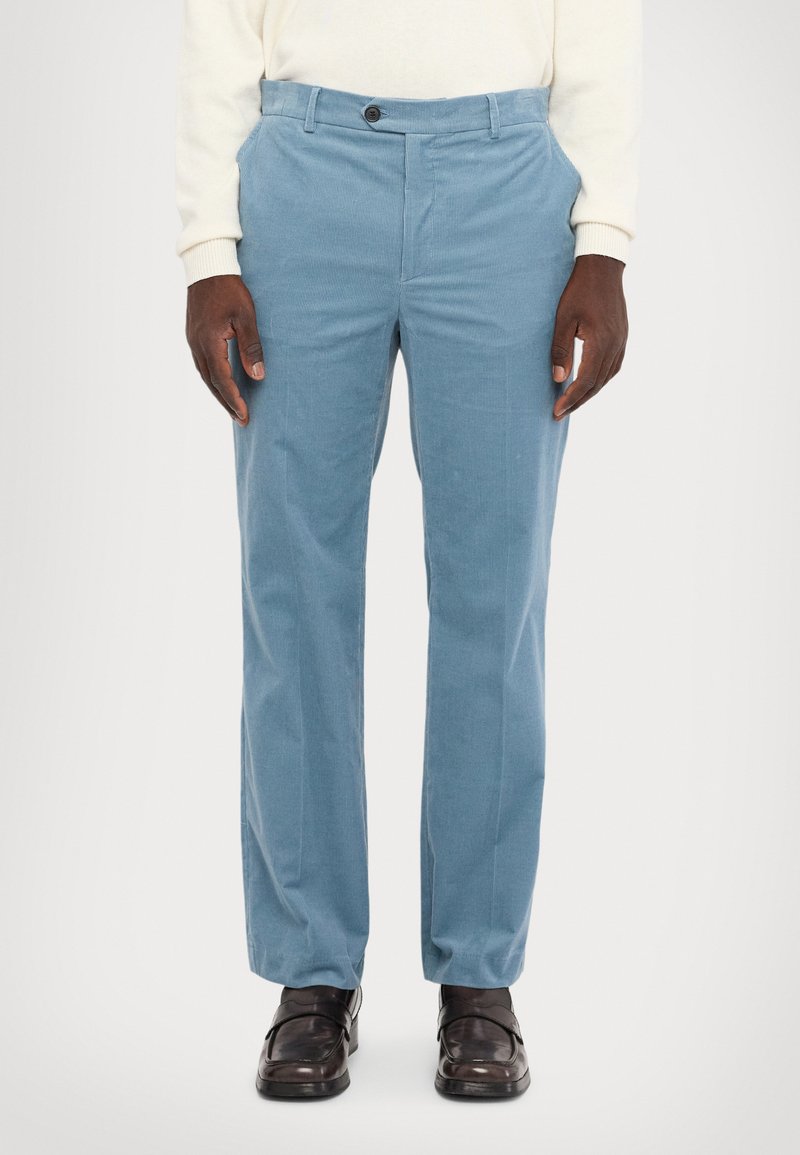 Light blue corduroy trousers with a straight cut, featuring a flat front, side pockets, and a single button closure. Textured fabric, smooth finish.