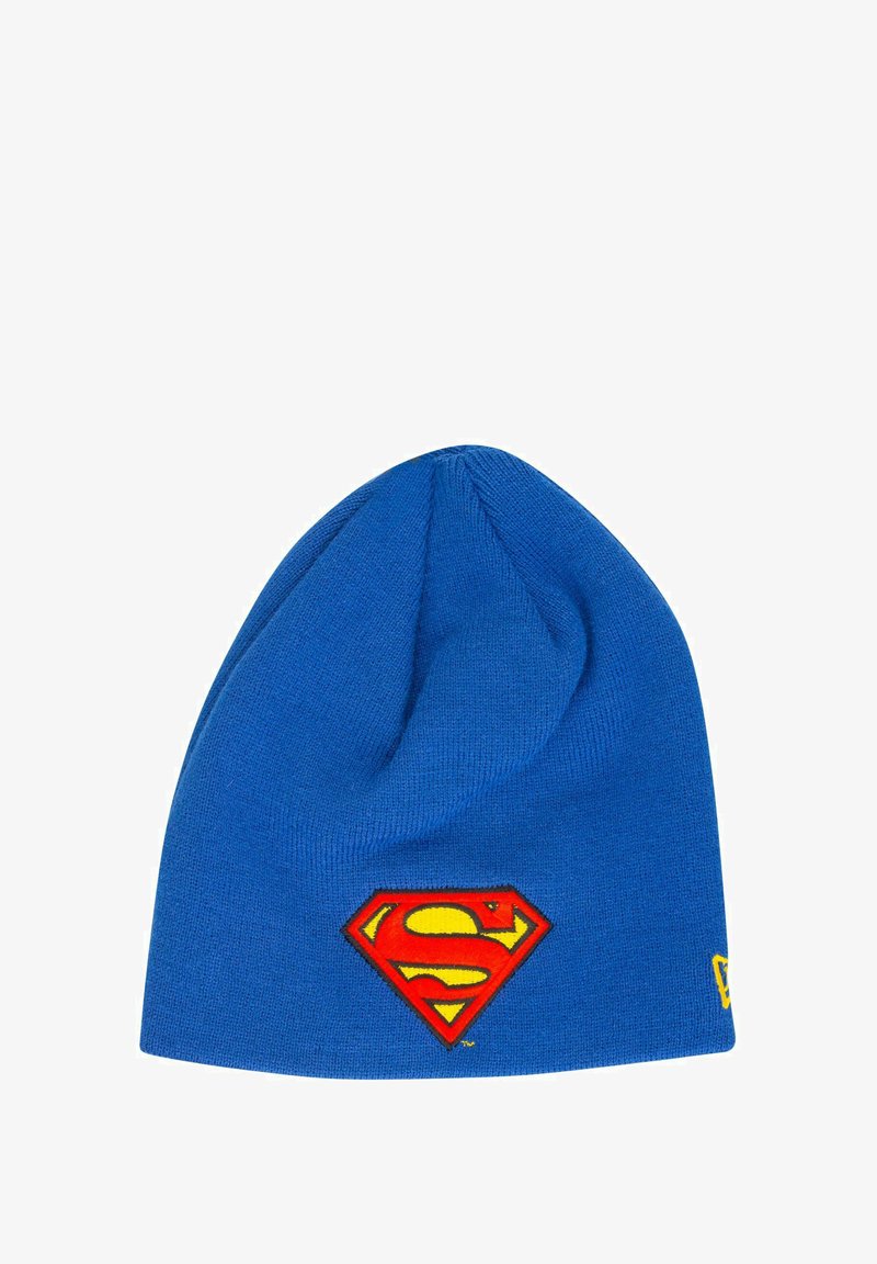Blue knit beanie hat featuring a red and yellow Superman logo patch. The fabric is smooth with a slight stretch and a rounded top shape.