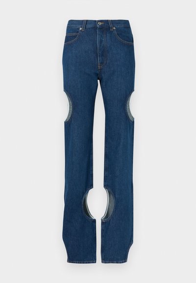 Denim jeans in dark blue with wide legs featuring cut-out sections on the outer sides, finished with standard pockets and stitching details.