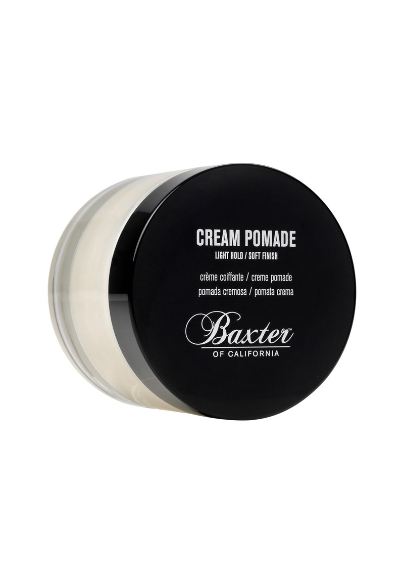 Vaso trasparente rotondo di pomata cremosa con un coperchio nero, etichettato "Pomata Cremosa", con testo bianco e un interno di colore crema chiaro.