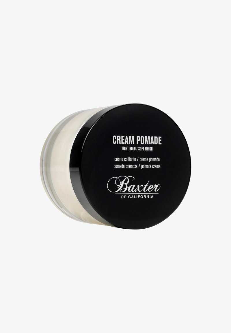 Klare runde Dose mit Haarkremel, schwarzem Deckel und der Aufschrift "Cream Pomade" in weißem Text, gefüllt mit einer hellen Cream-Innenfarbe.