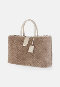 Brown faux fur handbag with quilted texture, cream leather handles, and a gold accent clasp. Includes a brand tag attached.