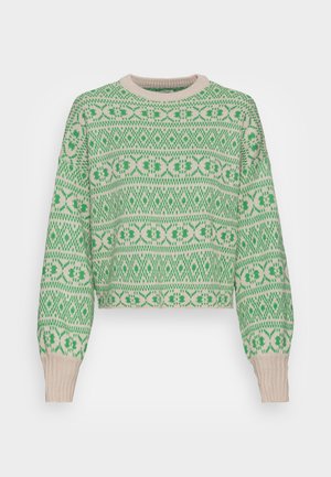 Pull en tricot vert et beige à manches longues avec un motif géométrique répétitif sur le corps et les poignets.
