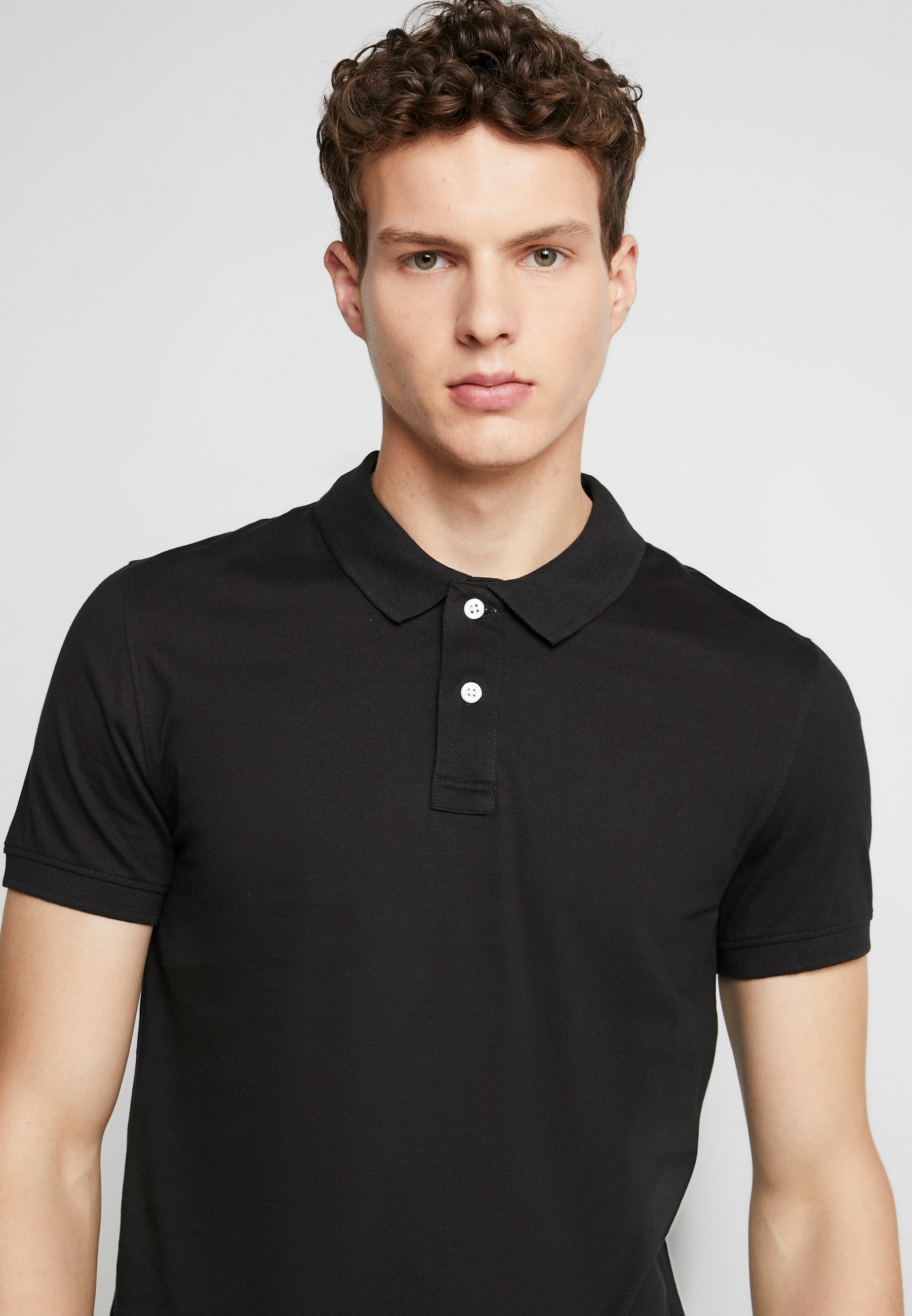 black polo shirt image