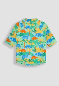 Cămașă pentru copii cu mânecă scurtă dintr-un material verde deschis. Prezintă un model colorat cu dinozauri, cu accente albastre, portocalii și galbene. Închidere la spate cu fermoar.