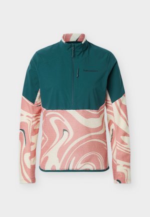 Pulóver s dlhým rukávom so zelenou hornou časťou a ružovo-bielym vzorom špirály na flísovej spodnej časti tela a rukávoch, s polovičným zipsom vpredu.