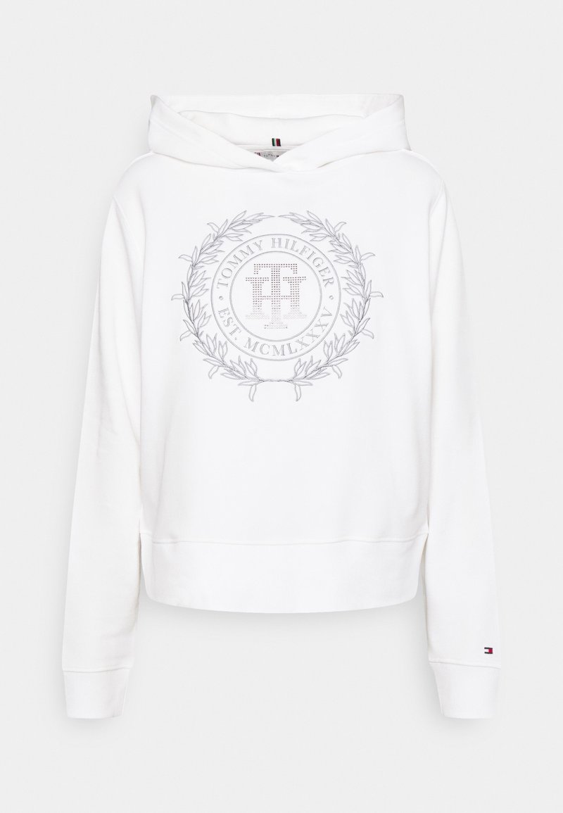 Sweat à capuche blanc Tommy Hilfiger avec un logo brodé circulaire et une couronne de laurier sur la poitrine, petit logo drapeau sur la manche gauche.