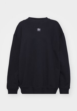 Crna majica s kapuljačom od mješavine pamuka, sa rebrastim izrezom i manžetama, s malim bijelim Adidas logotipom smještenim u sredini na prsima.