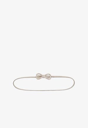 Cintura elastica argento con un fiocco decorato con strass al centro. Materiale liscio, design semplice, vestibilità regolabile.