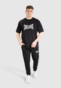 Smilodox Træningsbukser - schwarz