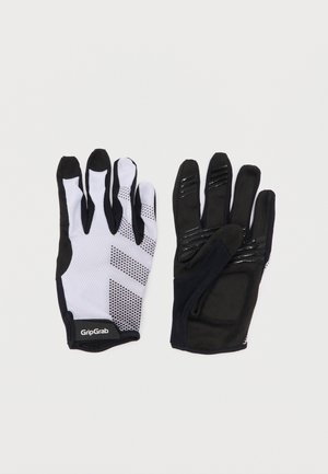 Pár čiernych a bielych cyklistických rukavíc GripGrab s textúrovaným úchopom a vystlanými dlaňami, položené na rovnej ploche ukazujúce prednú a zadnú stranu.