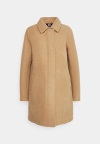 Beiger Wollmantel mit geradem Schnitt, großem Kragen und Seitentaschen; zeichnet sich durch klare Linien und eine glatte, strukturierte Oberfläche aus.