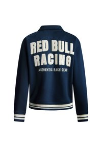 Marineblå sweatshirt med hvid broderet "RED BULL RACING" tekst. Ribbet manchetter og kant med to hvide striber. Blødt stof, krave-design.