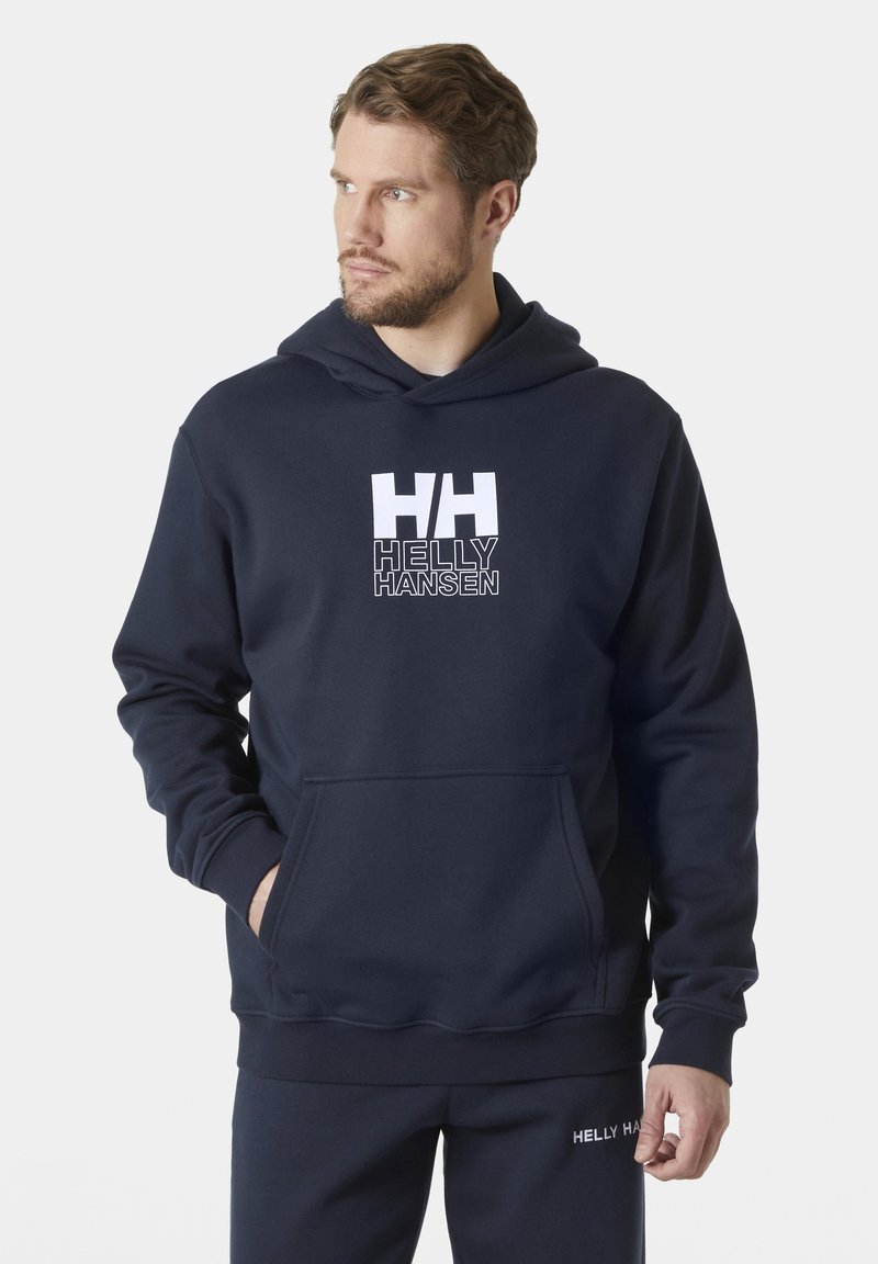 Marineblauwe hoodie gemaakt van een zachte katoenmix. Bevat een voorste kangoeroezak en een wit logo met "HH" en "HELLY HANSEN."