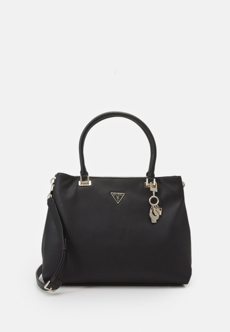 Black textured leather handbag with two top handles, detachable shoulder strap, gold-tone logo plaque, and decorative gold-tone keychain charms.